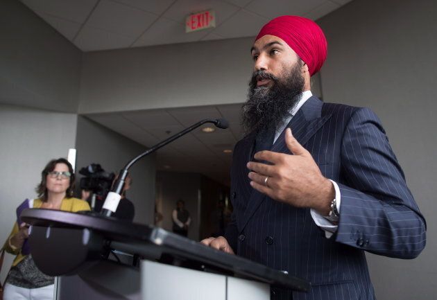 Jagmeet Singh responds to questions from reporters before the start of a three-day NDP caucus national strategy session in Surrey, B.C., on Sept. 11, 2018.