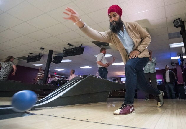 NDP Leader Jagmeet Singh bowls during a social outing with the NDP caucus after the first day of a three-day national strategy session in Surrey, B.C., on Sept. 11, 2018.