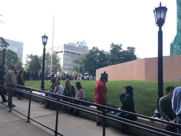 Members of the public wait to be let into the public gallery at Queen's Park on Sept. 12, 2018.