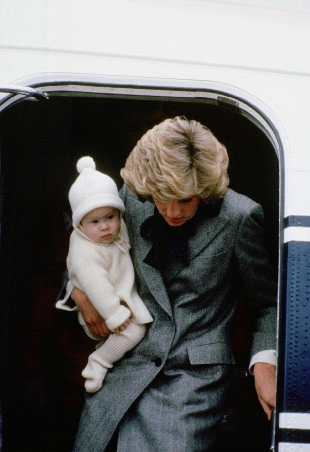 Diana carries Prince Harry off a flight at Aberdeen Airport.