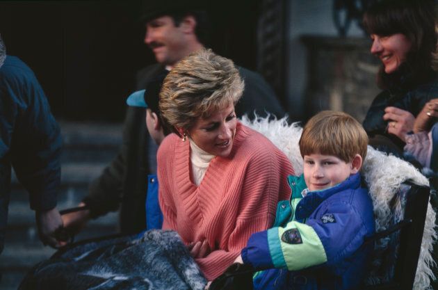 Princess Diana with sons Prince Harry and Prince William (to the right of his mother) take a ride in a horse-drawn sleigh in Austria on March 27, 1994.