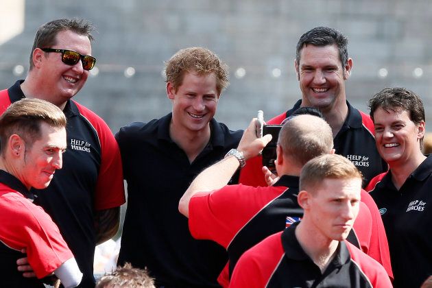 Prince Harry poses with members of the British Armed Forces Invictus Team during the Invictus Games in London on August 13, 2014.