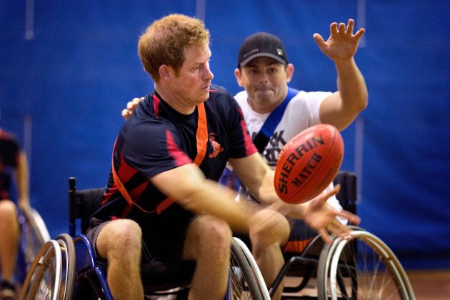 Prince Harry passes the ball during a game of wheelchair football at the Soldier Recovery Centre on April 15, 2015 in Darwin, Australia.