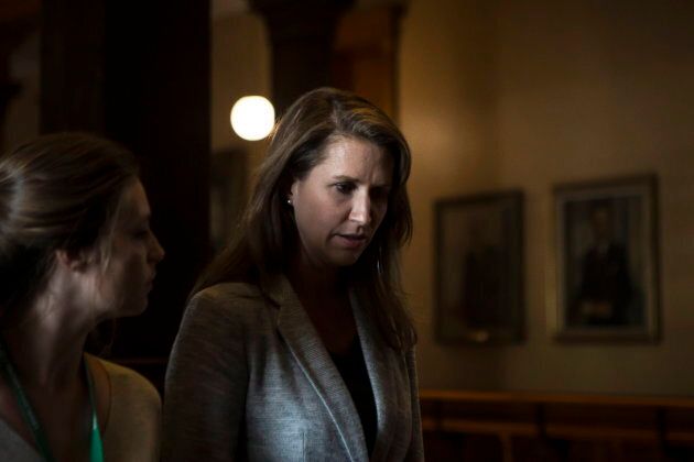 Caroline Mulroney walks away after scrumming with reporters after at the Ontario Legislature in Toronto, on Sept. 13, 2018.