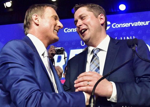 Andrew Scheer is congratulated by Maxime Bernier after being elected the new leader of the federal Conservative party in Toronto on May 27, 2017.