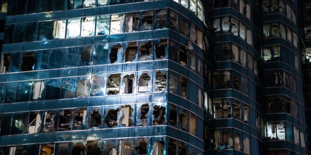 Windows of a commercial building damaged by Typhoon Mangkhut on September 16, 2018 in Hong Kong. City officials raised the storm alert to T10, its highest level.