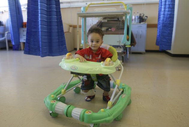 A boy sits in a baby walker in Benghazi, Libya, June 22, 2017. Walkers have been banned in Canada since 2004.