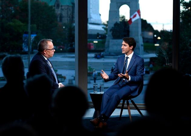 Prime Minister Justin Trudeau participates in an armchair discussion with Maclean's Paul Wells in Ottawa on Sept. 17, 2018.
