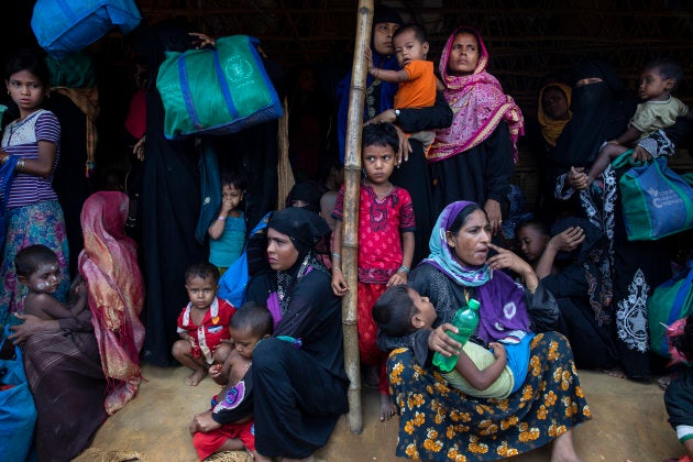 Rohingya women and children wait in line for a food distribution of super cereal on Aug. 26, 2018 in Cox's Bazar, Bangladesh.