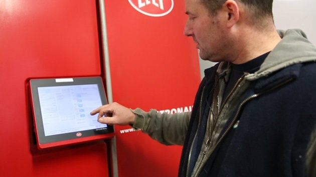 Pascal Thuot checks data on his dairy cows.