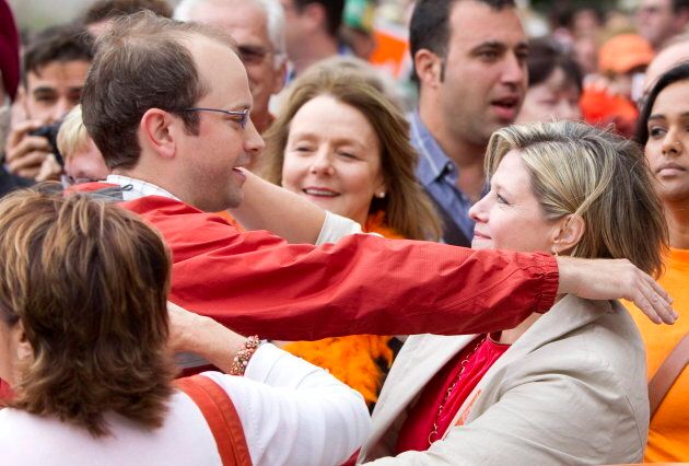 Toronto Coun. Mike Layton hugs Ontario NDP Leader Andrea Horwath at a labour day parade in 2011.