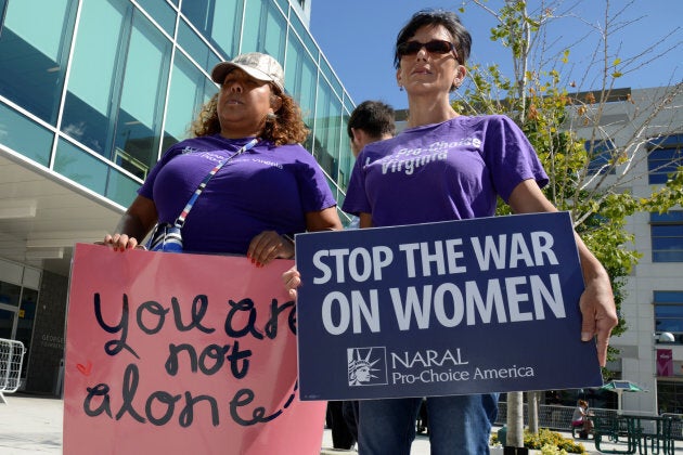 Demonstrators gather outside George Mason University in Arlington, Virginia prior to the arrival of U.S. Education Secretary Betsy DeVos, who is proposing a rollback of Obama-era sexual assault policies at American universities.