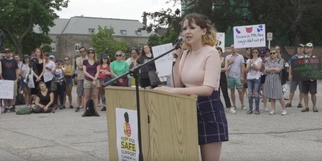 High school student Rayne Fisher-Quann reads her 'Open Letter to Doug Ford' at a rally outside of Queen's Park in Toronto on July 21, 2018. On Friday, students led by Fisher-Quann will stage a walkout to protest the premier's policies on education.