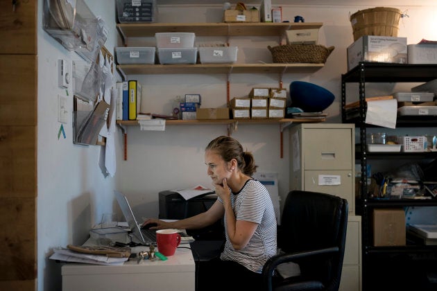 Hana Nelson, chief and head shucker at Afishionado Fishmongers, works in her office in Halifax on July 12, 2018.