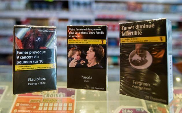 A cigarette vendor's store in Paris shows France's new "neutral" cigarette packs on Oct. 11, 2016.