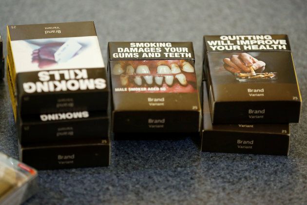 Mock-ups of plain cigarette packaging are seen before the start of a news conference in Ottawa on May 31, 2016.