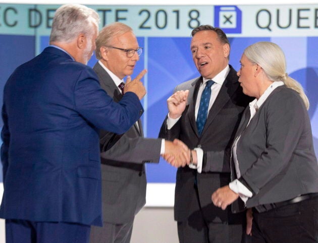 Liberal leader Philippe Couillard, left to right, PQ leader Jean-Francois Lisee, CAQ leader Francois Legault and Quebec Solidaire leader Manon Masse shake hands before their English debate Monday, September 17, 2018 in Montreal, Que.