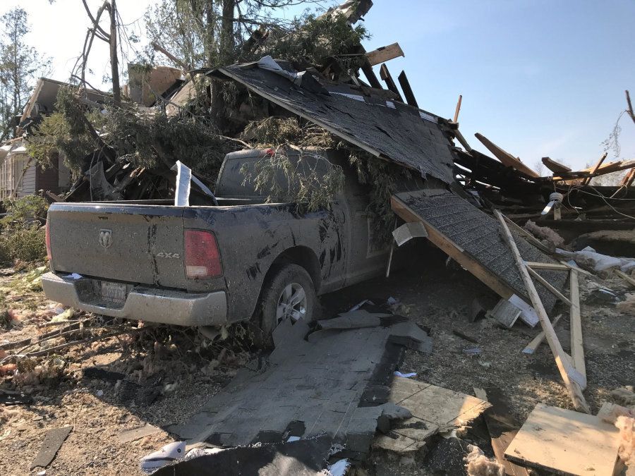 A truck is covered in debris after a tornado tore through Dunrobin, Ont. on Sept. 21, 2018.