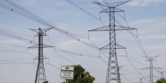 Power lines run through Hydro One Ltd. transmission towers in Toronto on July 12, 2018.