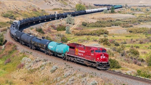 A Canadian Pacific Railway locomotive pulling a long freight train, including tanker railcars, near Medicine Hat, Alta., Thurs. Sept. 6, 2018.