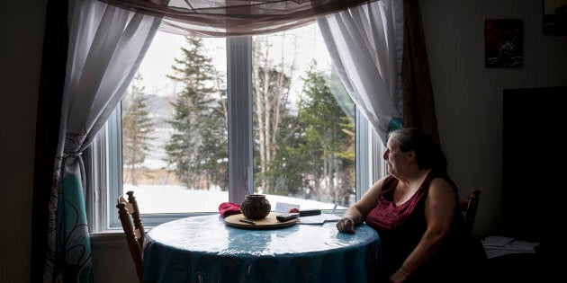 An emotional Charlotte Wolfrey sits in her home on March 23, 2018 after recounting the day her daughter Deidre killed in a murder-suicide.