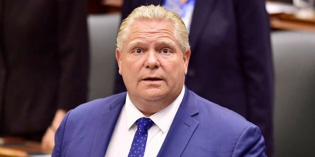 Ontario Premier Doug Ford applauds as Lt.-Gov. Elizabeth Dowdeswell delivers the speech from the throne to open the new legislative session at the Ontario Legislature at Queen's Park in Toronto on June 12, 2018.