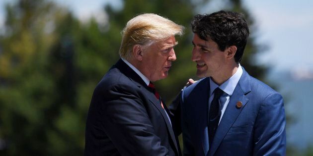 U.S. President Donald J. Trump (L) and Prime Minister Justin Trudeau (R) shake hands during the Welcome Ceremony at the G7 summit in Charlevoix, June 8, 2018