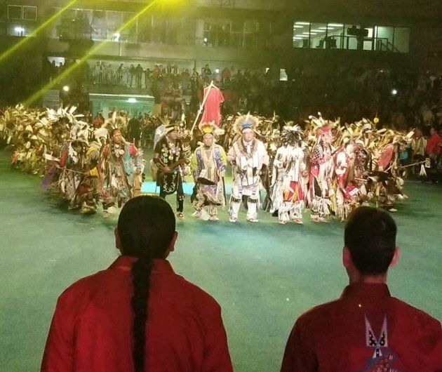 Indigenous men formed a circle around a red dress, meant to symbolize missing and murdered Indigenous women across Canada and the U.S.
