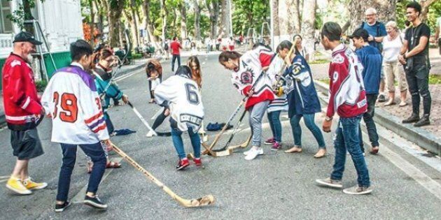 Ron Reeleder oversees a game of ball hockey in Vietnam.