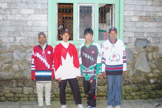 Mt. Everest porters pose for a photo in the first four jerseys Reeleder handed out.