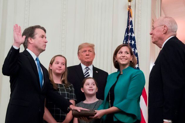 Brett Kavanaugh is sworn-in as associate justice of the U.S. Supreme Court by retired Associate Justice Anthony Kennedy as wife Ashley Estes Kavanaugh, daughters Margaret and Elizabeth, and U.S. President Donald Trump on Oct. 8, 2018, at the White House in Washington, D.C.