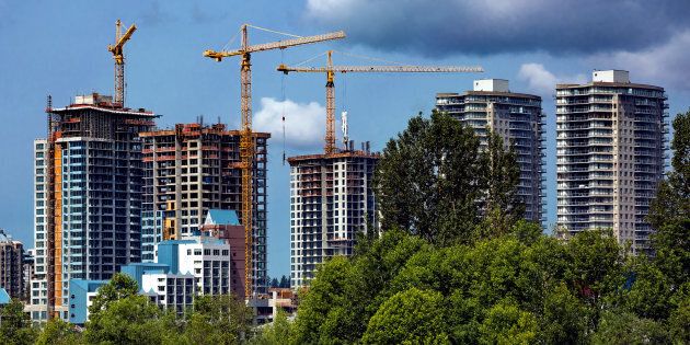 Residential towers under construction in New Westminster, B.C. Canada's housing market slowdown, which began with a drop in sales, is now spreading to home construction.
