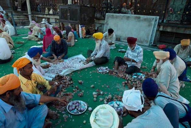 Devotees volunteer to prepare langar Sri Harmandir Sahib, the holiest temple of Sikhism.