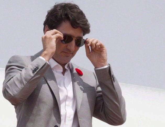 Prime Minister Justin Trudeau removes his sunglasses as he arrives in Ho Chi Minh City, Vietnam on Nov. 9, 2017. Trudeau is sporting P.E.I. made sunglasses from Fellow Earthlings eyewear.