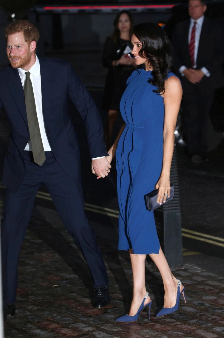 Meghan and Harry at the 100 Days to Peace Gala in London. Was this dress a calculated choice to camouflage her pregnancy?