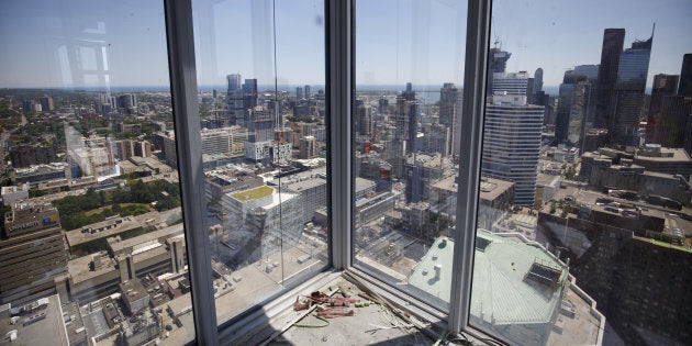 The city skyline is seen from an apartment building under construction in Toronto on July 10.