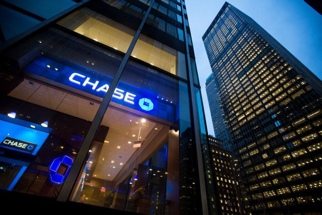 JPMorgan Chase & Co. signage is displayed at a bank branch, left, across from its Park Avenue headquarters, right, in New York, U.S., on Jan. 12, 2016.