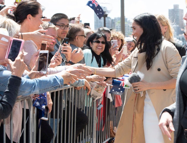 The duchess shakes hands with the public.