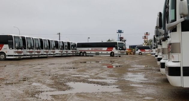 Chartered buses gather up an army of workers from their homes and deposit the crews at a handful of operating mines.