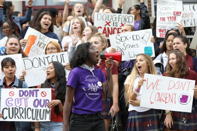 A student uses a megaphone to lead the students of Notre Dame High School, an all-girl's Catholic school in Toronto, in protest of the province's repeal of the sex-ed curriculum and replacement of it with an outdated version, on Sep. 20, 2018.