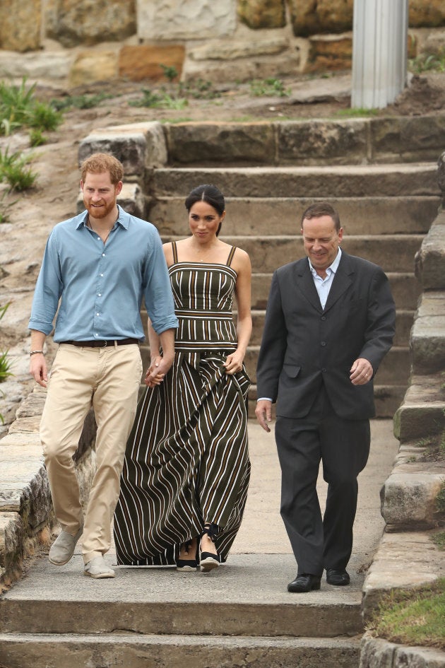 Prince Harry and and Meghan, Duchess of Sussex walk down to Bondi Beach with Waverley Mayor John Wakefield on Friday, Oct. 19, 2018 in Sydney, Australia.