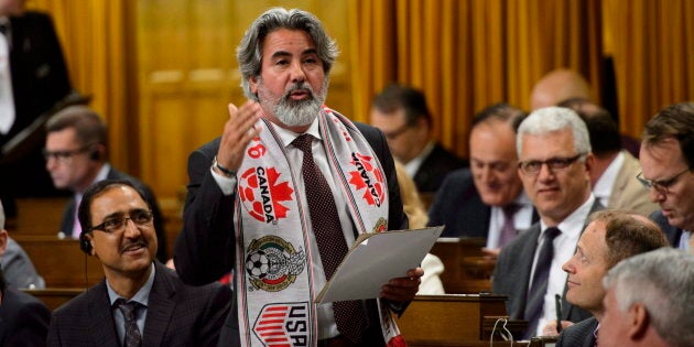 Pablo Rodriguez sports a soccer scarf as he delivers a statement in the House of Commons on June 13, 2018.