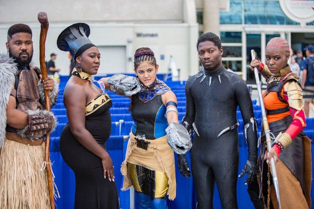 Fans dressed as characters from Marvel's Black Panther movie attend Comic-Con International on July 20, 2018 in San Diego, California.