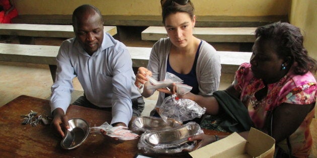 Christina Hassan works alongside health workers at the Mukono Health Centre in Uganda in 2016.