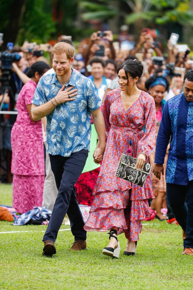 Prince Harry and Meghan Markle arrive at University of the South Pacific on Wednesday in Suva, Fiji.