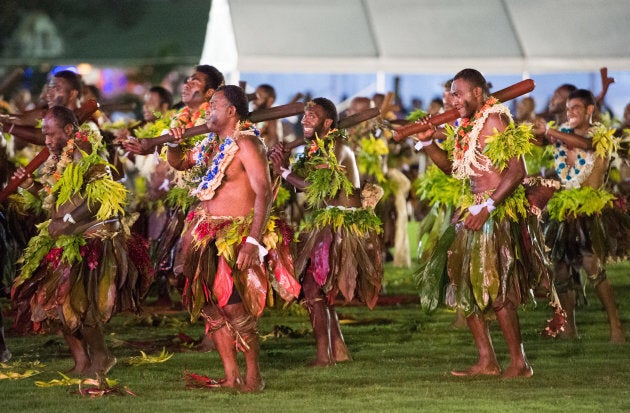 Suva locals take part in an official welcome ceremony in the city centre's Albert Park for Meghan and Harry on Tuesday.