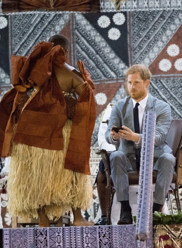 Prince Harry takes a sip of Kava, the national drink of Fiji.