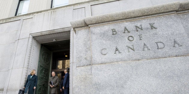 Senior deputy governor Carolyn Wilkins and Governor Stephen Poloz leave the Bank of Canada building for a press conference in Ottawa on Oct. 24, 2018.