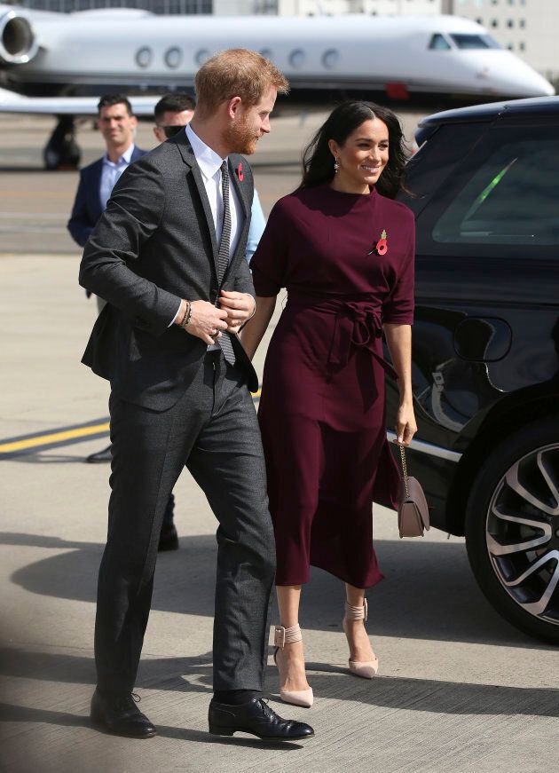 Prince Harry and Meghan Markle arrive at the airport following the Invictus Games in Sydney on Oct. 28, 2018.