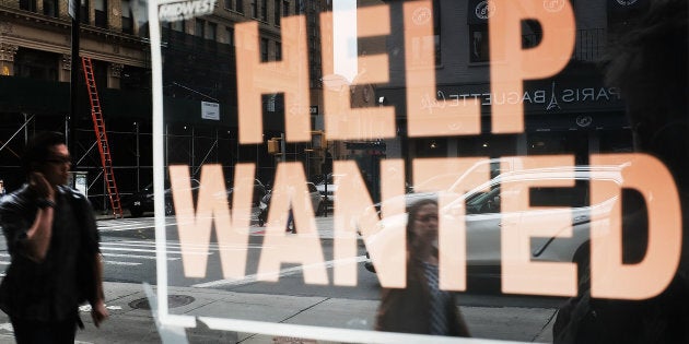 A help-wanted sign in the window of a business in Brooklyn, N.Y., Oct. 5. Canadian business are reporting a record labour shortage, but it doesn't seem to be helping Canadians find work any faster.